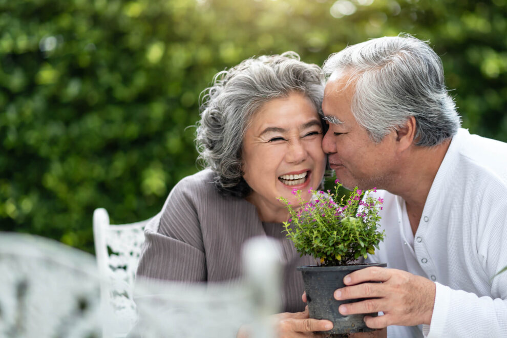 Happy older couple in a garden